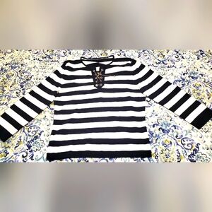 Adorable sweater with nautical vibes.